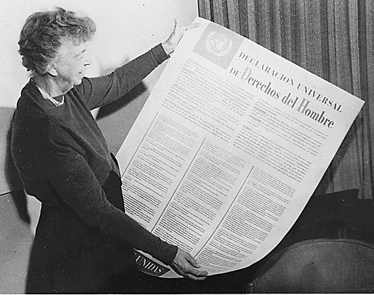 Eleanor Roosevelt with the Spanish version of the Universal Declaration of Human Rights.