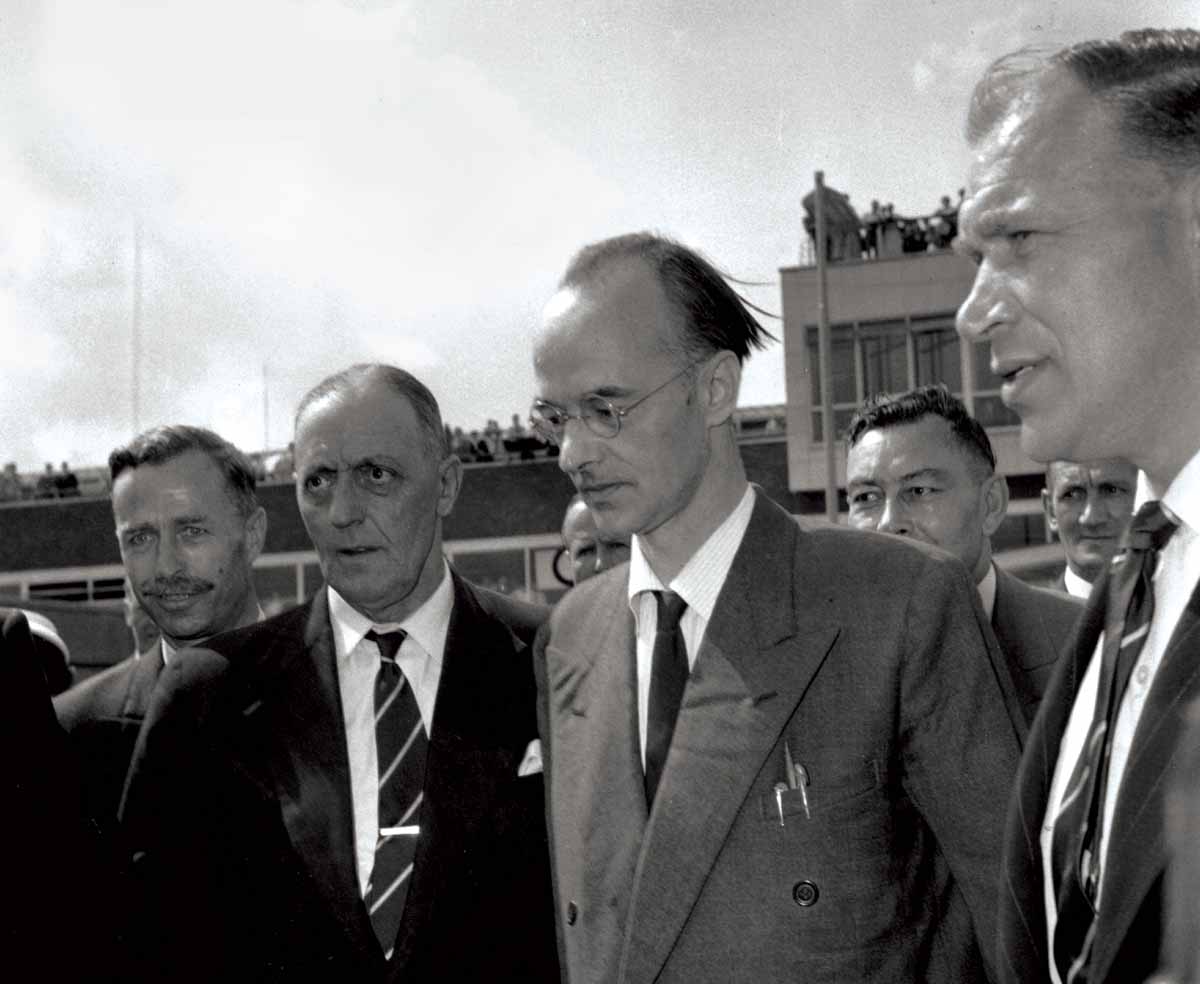 Klaus Fuchs (second from right) under escort at Heathrow Airport, 27 June 1949 © Getty Images.