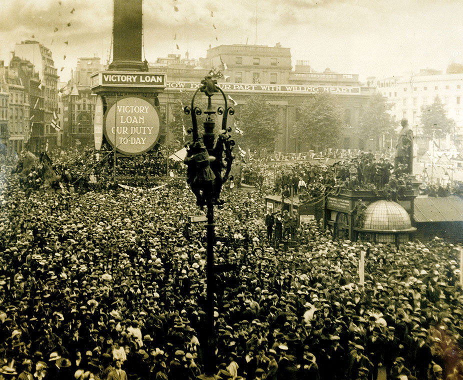 Crowds celebrate the Armistice in Trafalgar Square.