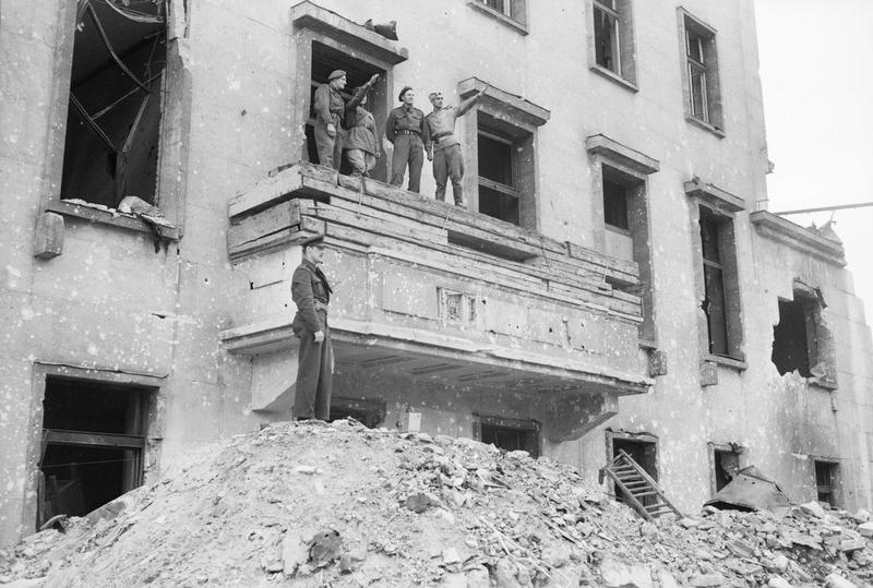 British and Russian soldiers on the balcony of the ruined Chancellery in Berlin, 5 July 1945.