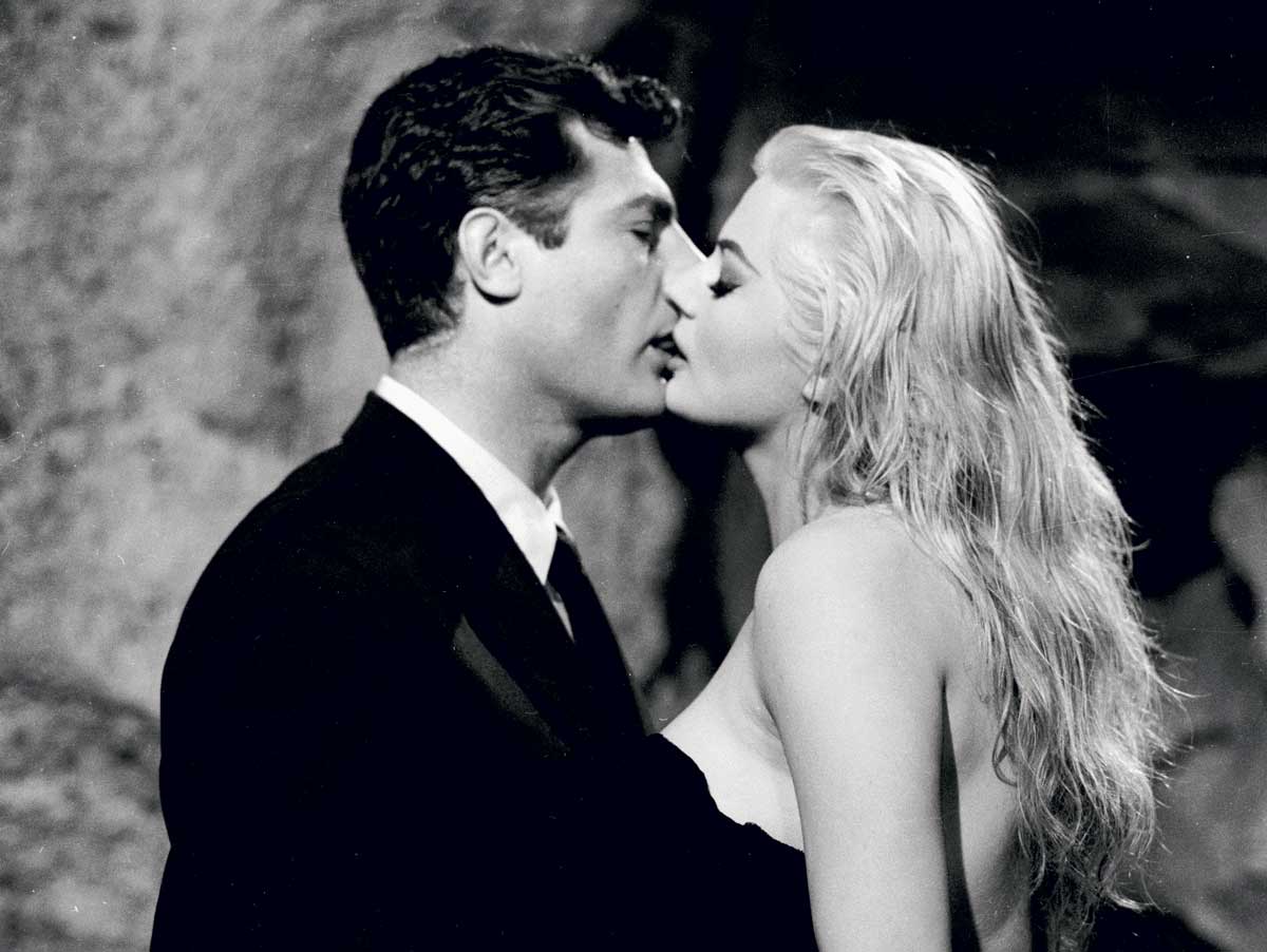 Marcello Mastroianni and Anita Ekberg in La Dolce Vita, 1960. Still from La Dolce Vita (Pathé, 1960). Directed by Federico Fellini. Produced by Giuseppe Amato and Angelo Rizzoli. Cinematography by Otello Martelli. Photo © John Kobal Foundation/Getty.