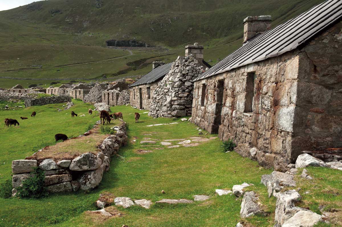 Derelict cottages in Village Street, Hirta,  St Kilda. Vincent Lowe/Alamy.