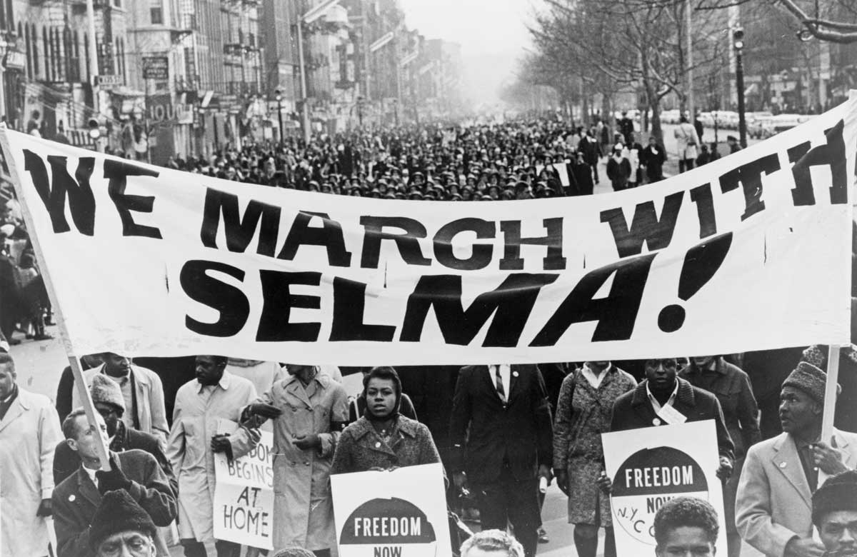 marchers carrying banner 'We march with Selma!' on street in Harlem, New York City, New York, 15 March 1965. Library of Congress.
