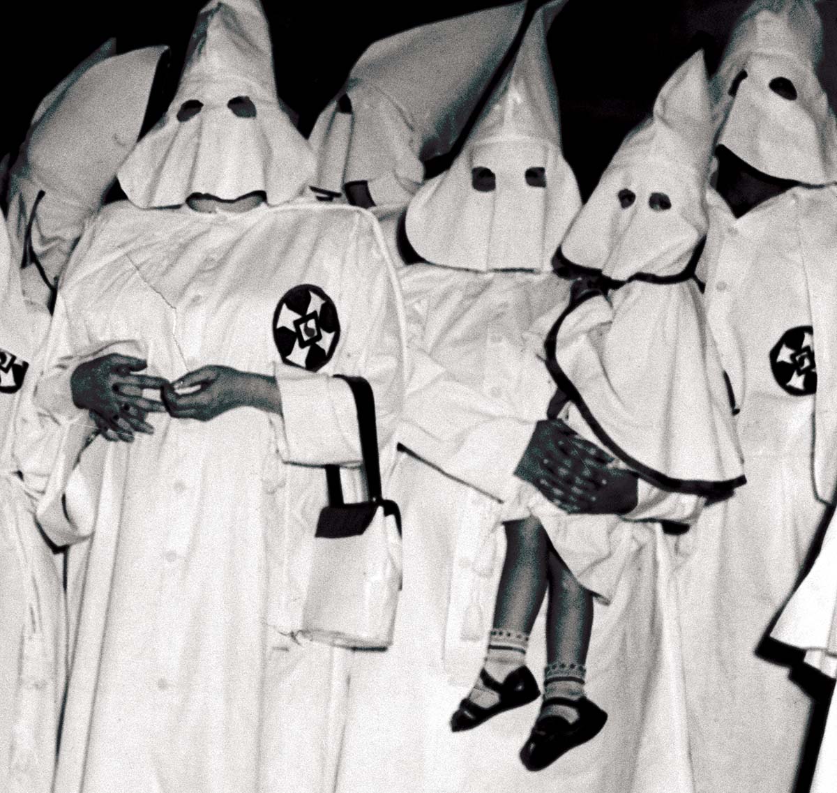 Women (and child) at a Ku Klux Klan mass-initiation ceremony, Atlanta, Georgia,  18 June 1949 © Getty Images