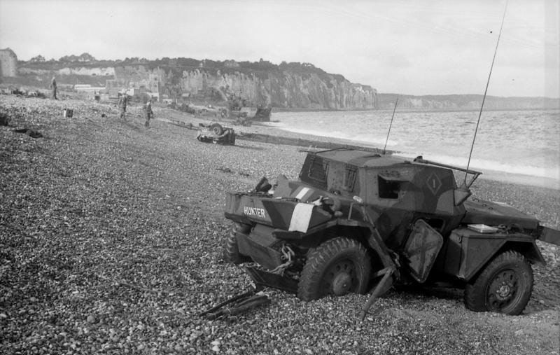 Dieppe's chert beach and cliff immediately following the raid on 19 August 1942. A Dingo Scout Car has been abandoned.