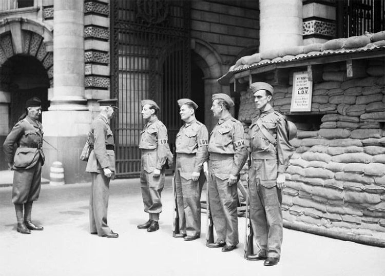 Local Defence Volunteers: The first manned Local Defence Volunteers (LDV) post in central London. The men pictured are being inspected by General Nation and Major Hughman.