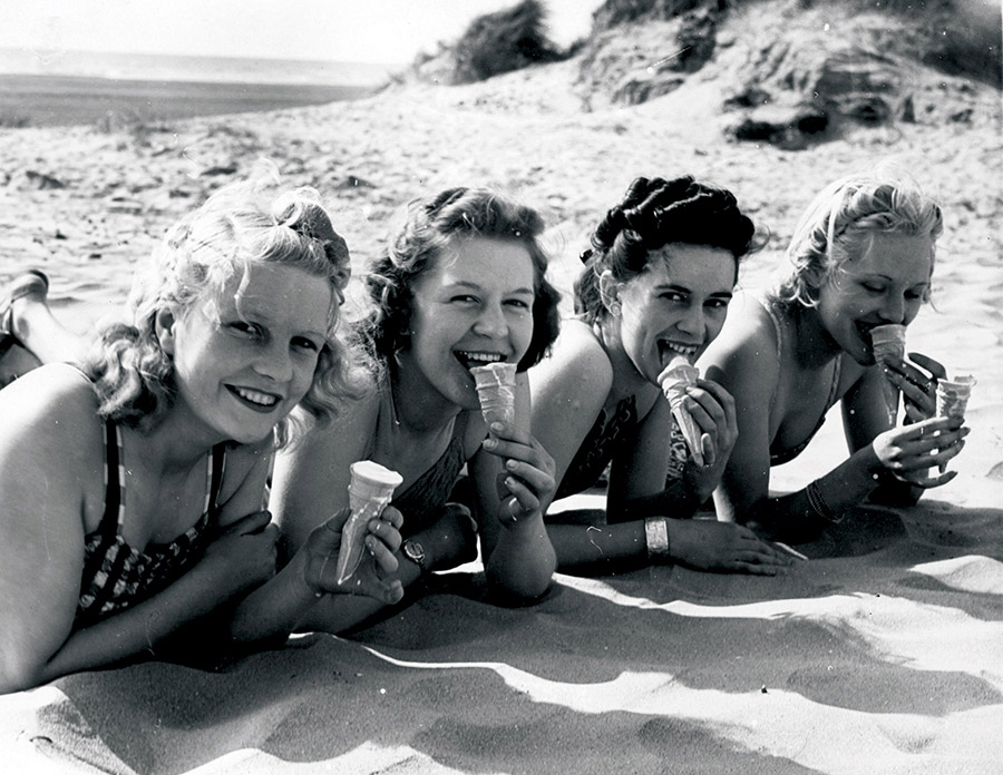 Women enjoying ice creams on Blackpool beach, 1939.