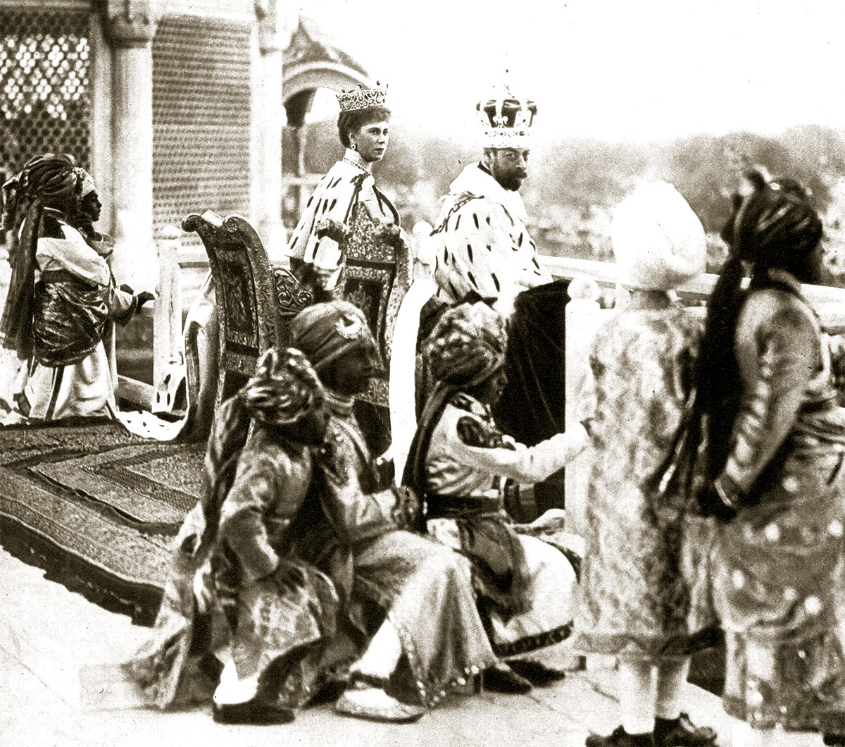 George V and Queen Mary watching the Delhi Durbar from the Red  Fort, accompanied by Indian princes acting as pages, 1911.