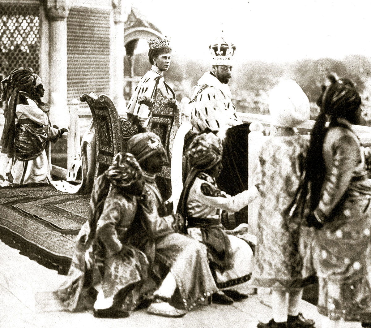 George V and Queen Mary watching the Delhi Durbar from the Red  Fort, accompanied by Indian princes acting as pages, 1911. © Getty Images.