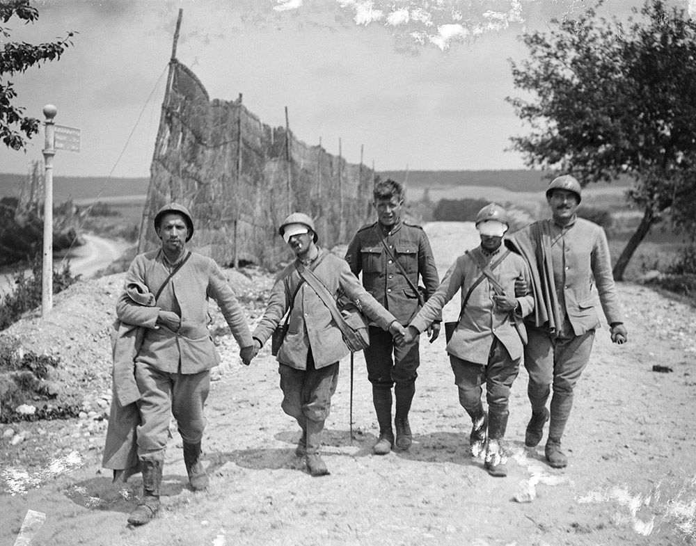 Holding the line: French soldiers blinded by gassing at the Marne, 1918. Alamy.