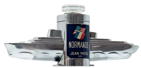 A chrome bottle of perfume in the shape of SS Normandie housed a scent created by Jean Patou, 1935.