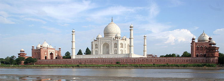 Taj Mahal and outlying buildings as seen from across the Yamuna River