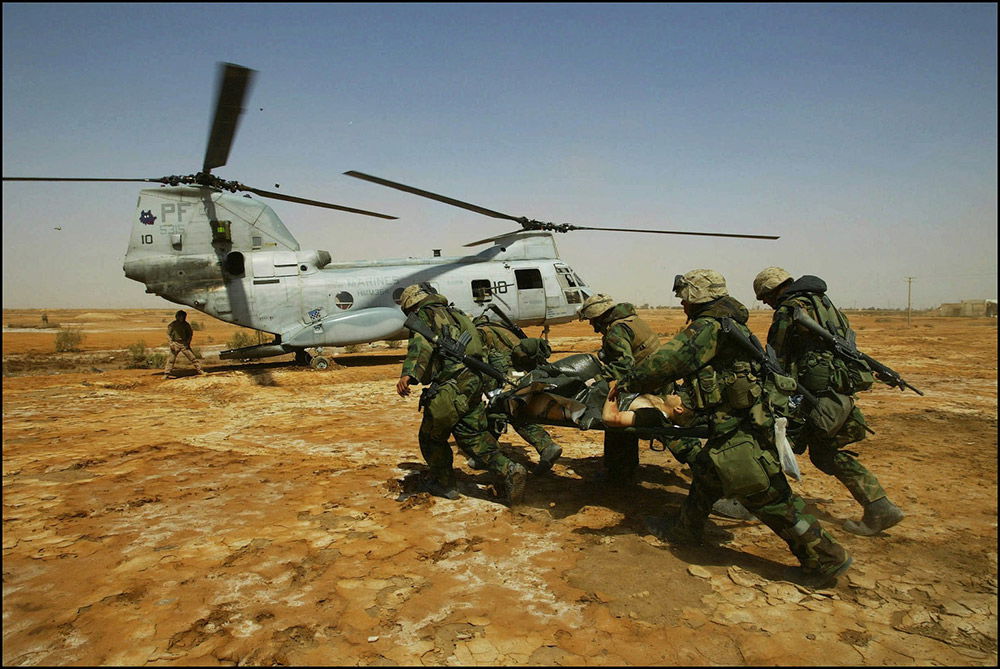 US Marines evacuating wounded comrades, Kut al-Amara, 3 April 2003. (Gilles Bassignac/Gamma-Rapho, Paris)