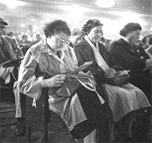 A group of women listen out for their numbers at a game of bingo in the Trocadero Cinema, Elephant and Castle, London 1961