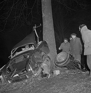 Rescuers examine the shattered wreckage of the Facel Vega sports car in which Camus died. Corbis/Bettmann