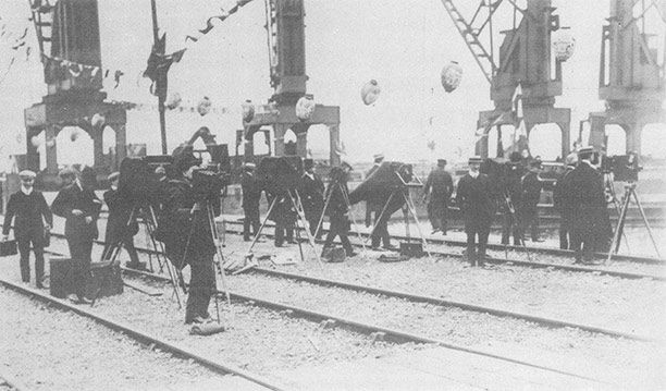 Photo-call: the press waiting for the king and queen at Cardiff docks - but not all their royal shots were so staged or reverential