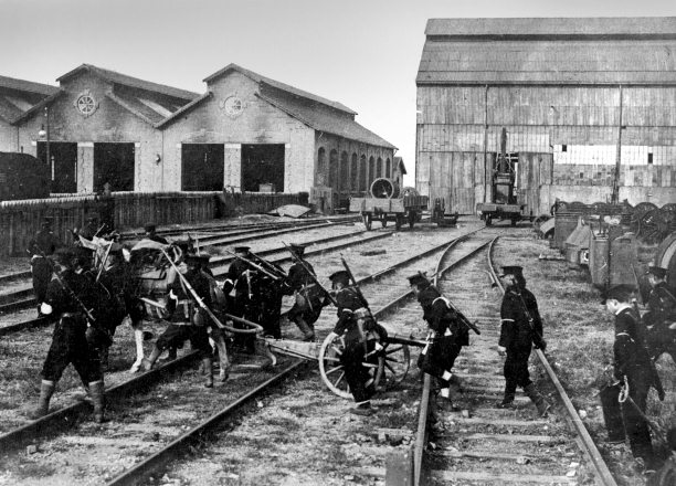 Revolutionary soldiers move a cannon over rail tracks. Many Chinese resented foreign investors building their railways. Photograph by Francis Stafford