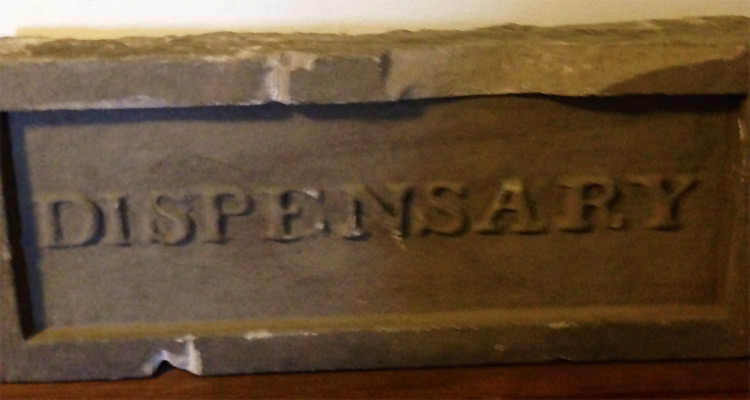 Original flagstone above dispensary door (author's photograph)