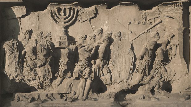A detail from a relief on the Arch of Titus, built in AD 81 in honour of Titus' victory over the Jews in AD70. It shows a triumphal procession, carrying the Menorah, the seven-branched candelabrum of the Temple of Solomon. Photo: AKG Images/Erich Lessing