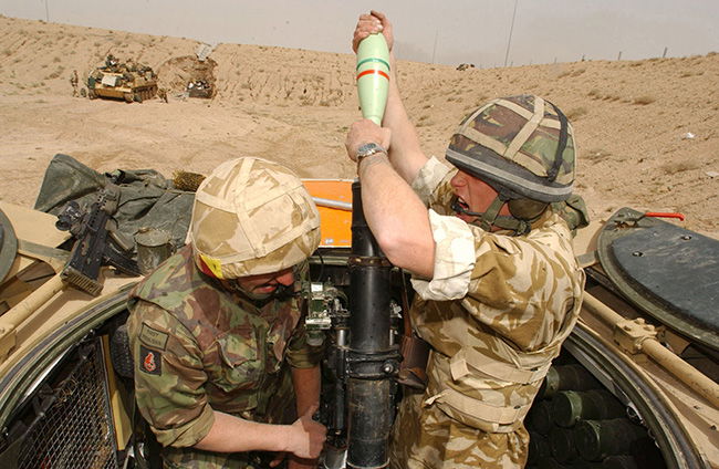 British soldiers engage Iraqi Army positions south of Basra, 26 March 2003.