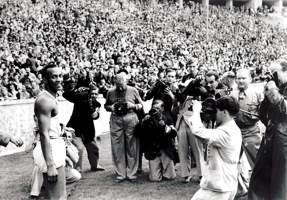 Defiant: Jesse Owens after winning the 100m at the Berlin Olympics, August 1936 © Getty Images