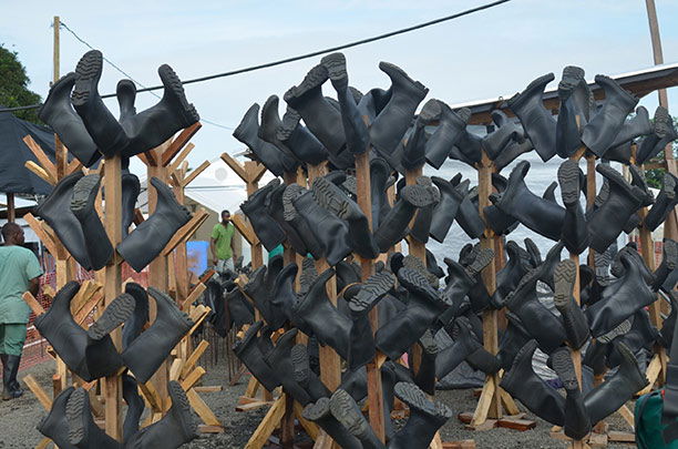 Rubber boots at a Médecins Sans Frontières medical centre, Monrovia, October 18th, 2014. (Zoom Dosso / Stringer / Getty Images)