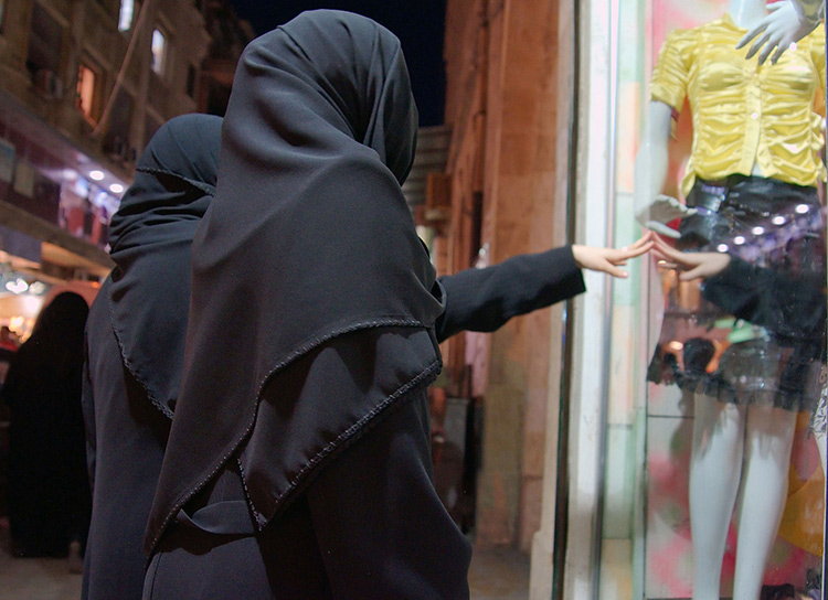 Worlds apart: women window-shop in Aleppo, Syria, 2008.