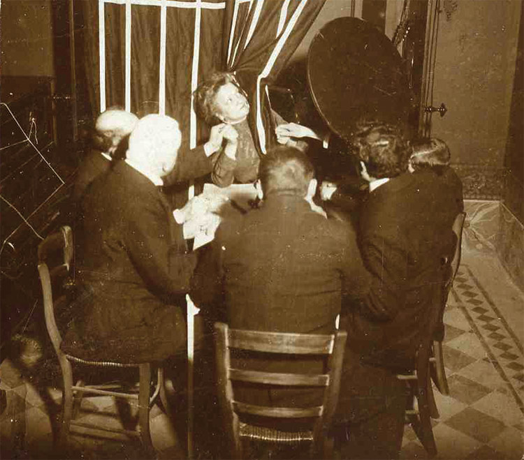 A seance with Eusapia Palladino, early 20th century. Photograph in the Museo di Antropologia Criminale, University of Turin, Italy.