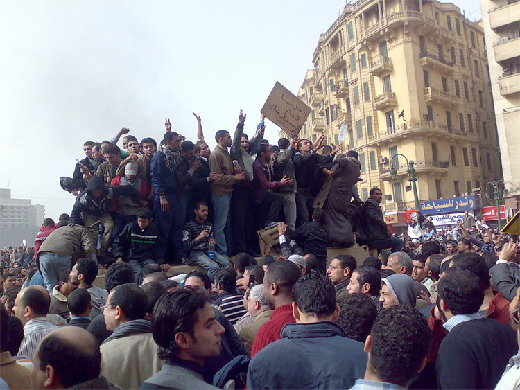 Demonstrators on Army Truck in Tahrir Square, Cairo by Ramy Raoof.  Licensed under CC BY 2.0 via Wikimedia Commons.