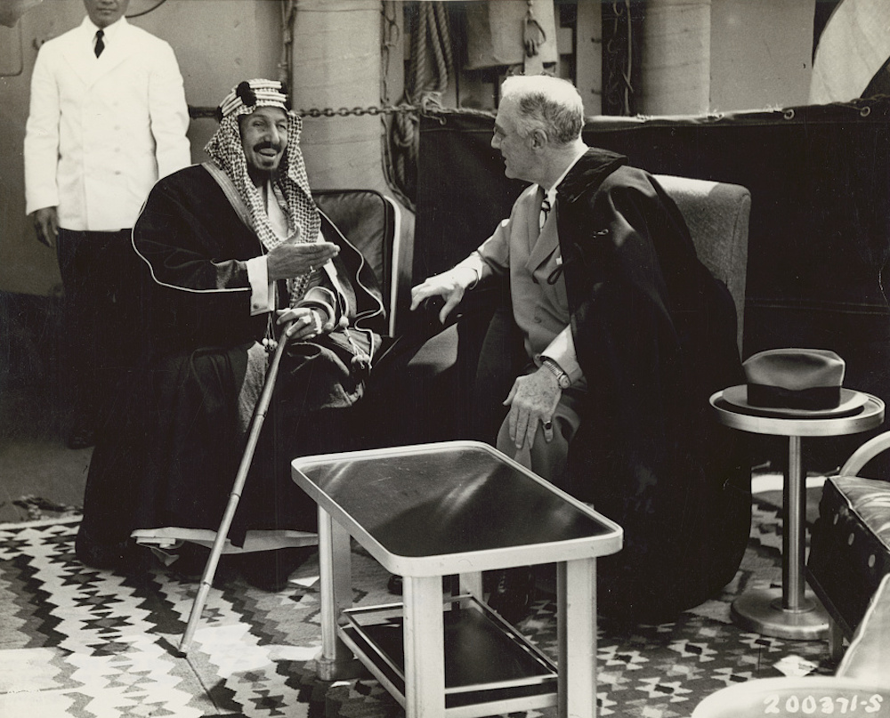 King Ibn Saud of Saudi Arabia and President Franklin D. Roosevelt converse on the deck of a U.S. warship in the Great Bitter Lake near Cairo after Roosevelt's attendance at the Yalta conference