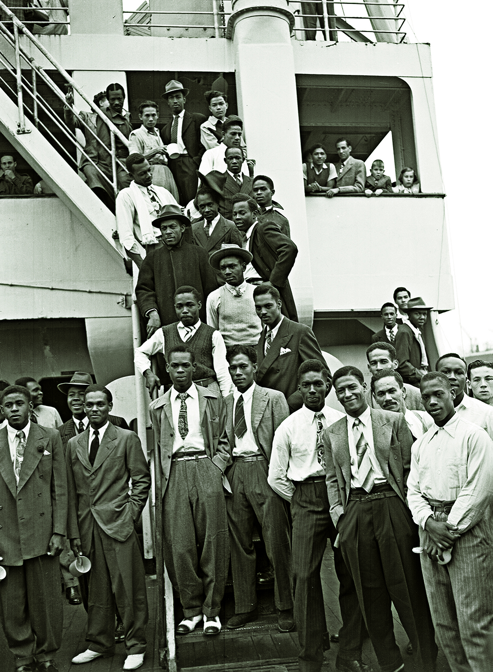 Jamaican men, many of them former RAF servicemen, disembark Empire Windrush at Tilbury Docks, 22 June 1948.