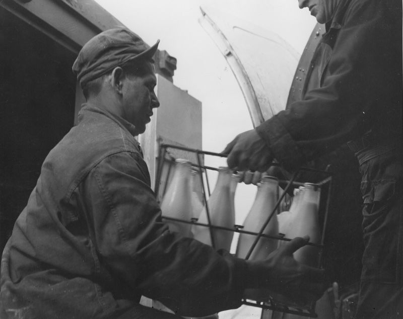 A C-47 transport plane is loaded at Wiesbaden air base for the Berlin airlift, 18 August 1948. US National Archives and Records Administration. Public Domain.