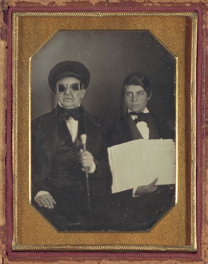 Unknown blind man and his reader holding a copy of the New York Herald, 1850. Metropolitan Museum of Art. Public Domain.