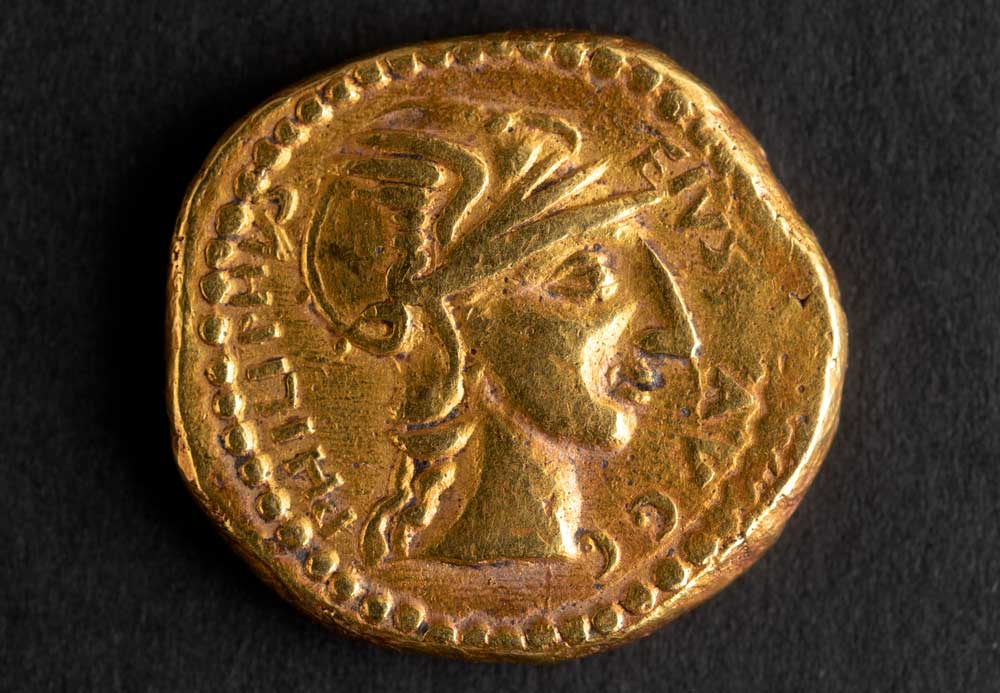 The obverse of a Philip I/II imperial gold coin, depicting the bust of Roma wearing a winged helmet, c.260-70.