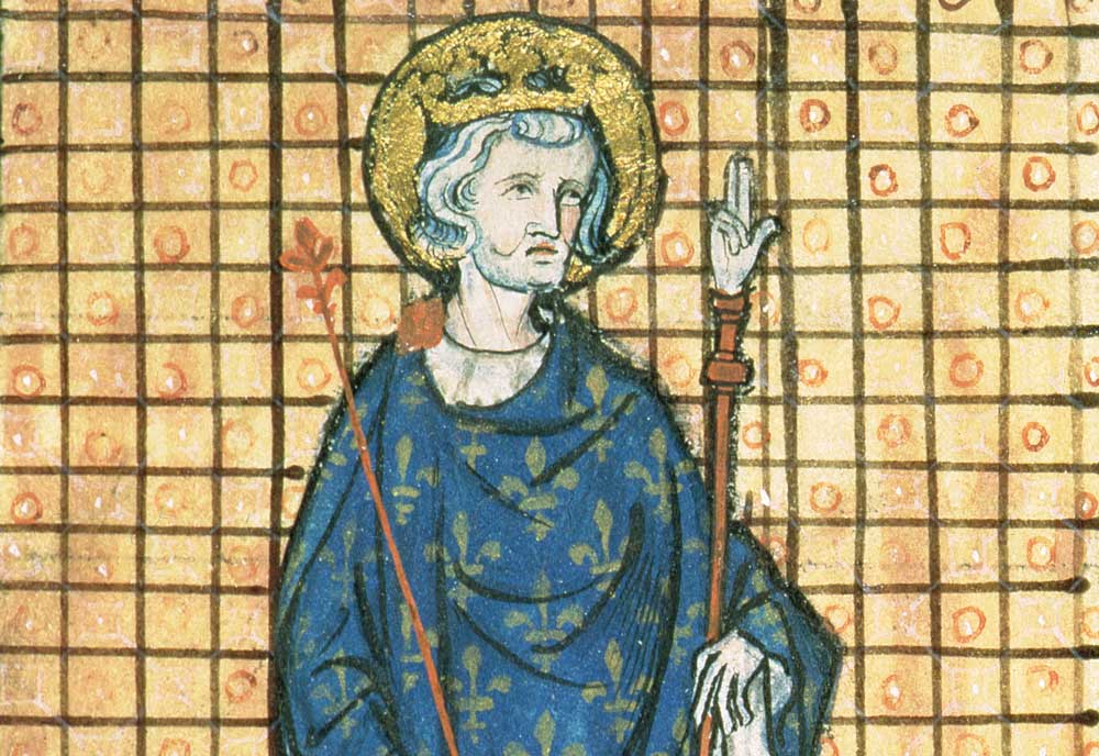 Louis IX carrying the Sceptre and the Hand of Justice, from Registre des Ordonnances de L’Hotel du Roi, c.1320. Bridgeman Images.