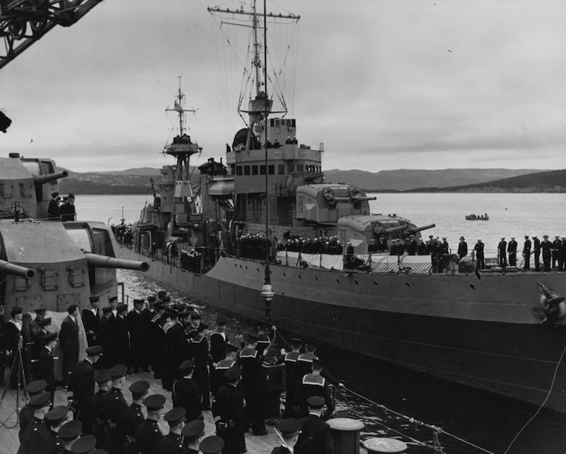 USS McDougal pulls up alongside HMS Prince of Wales in Placentia Bay, Newfoundland, 10 August 1941. US Naval History and Heritage Command. Public Domain.