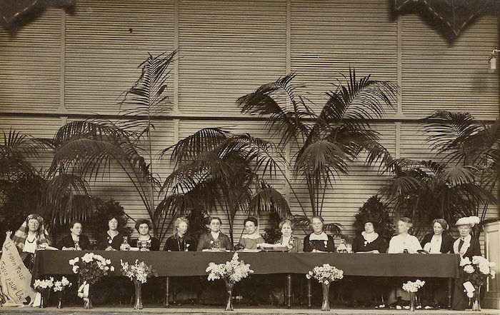 International Congress of Women in session, 1915. Rosika Schwinner fourth from the left, Jane Addams sixth, Aletta Jacobs eighth, and Chrystal Macmillan ninth. LSE Library. Public Domain.