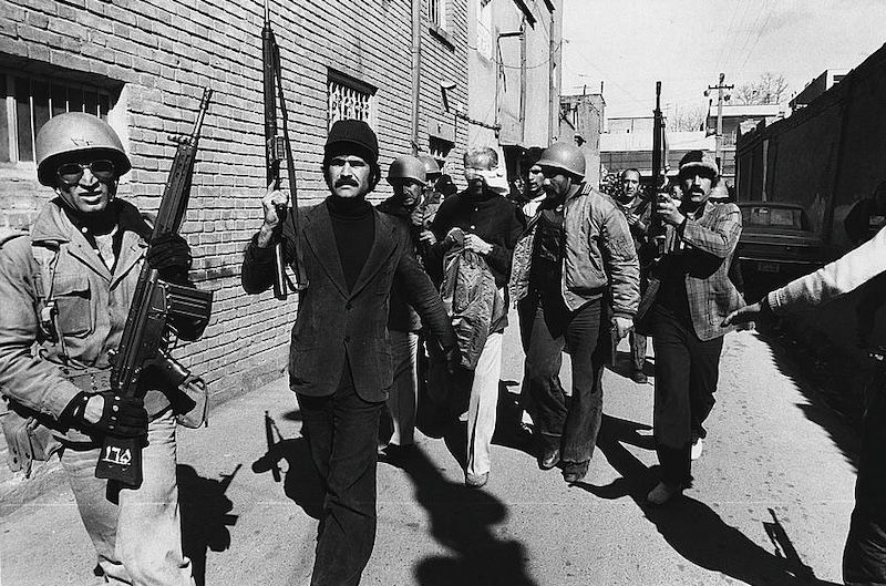 Blindfolded soldiers being marched away by revolutionaries, Tehran, Hatami, 12 February 1979. Library of Congress. Public Domain.