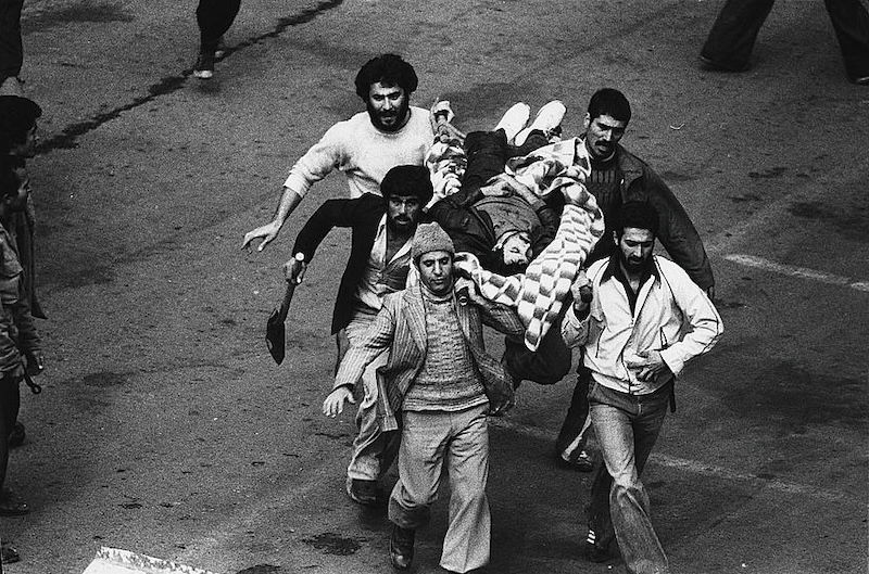 A wounded protestor being carried to safety in Tehran, Hatami, 11 February 1979. Library of Congress. Public Domain.