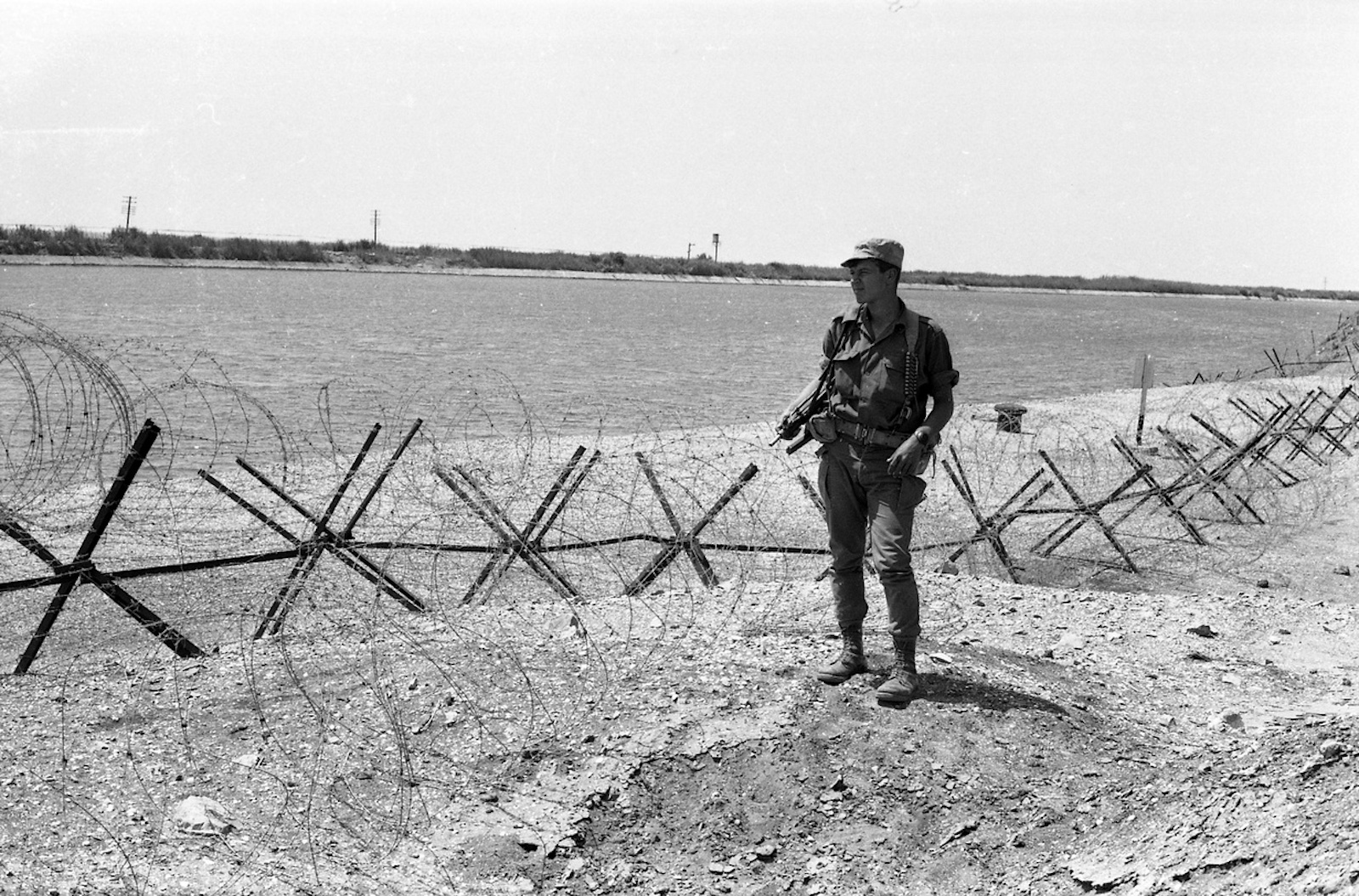 An Israeli soldier stands watch on the Suez Canal, taken from Egypt in the Six Day War, c. 1971. National Library of Israel (CC BY).