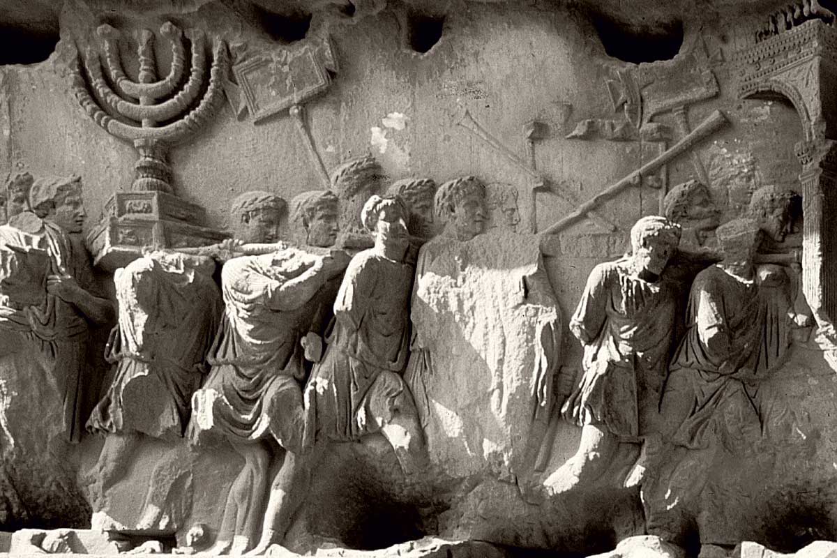 Frieze panel showing triumphant Romans carrying the seven-branched menorah from the Temple of Jerusalem from the Arch of Titus, Rome © Werner Forman Archive/Getty Images.