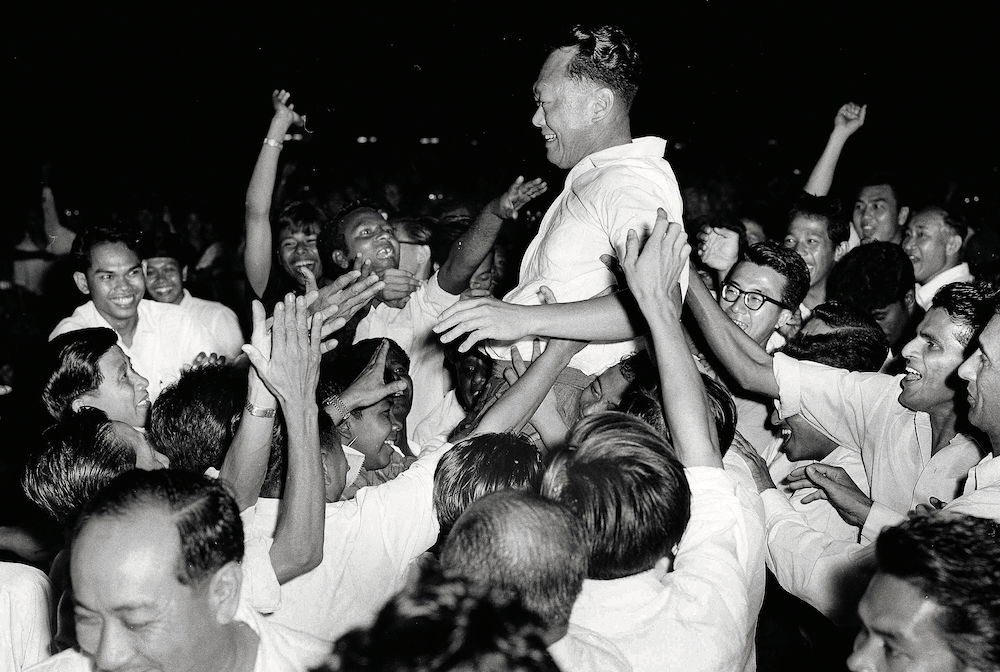 Lee Kuan Yew surrounded by supporters of the People’s Action Party following their victory in the September 1963 Singapore elections, held five days after the formation of Malaysia.