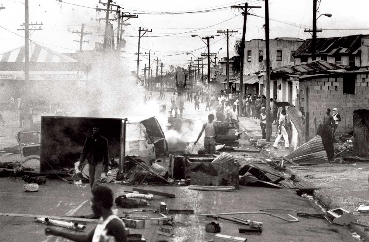 The road leading  to Tivoli Gardens with roadblocks erected by JLP supporters, following the PNP’s election victory that day, 1989. Marc French/Panos Pictures.