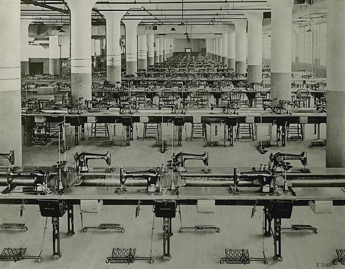 Singer sewing machines in a factory, 19th century. New York Public Library. Public Domain.