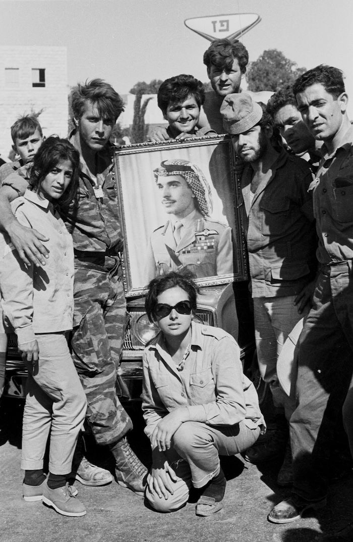 Israeli soldiers pose with a portrain ofg King Hussein of Jordan on Day Six of the Six Day War, by Dan Hadani, 1967. National Library of Israel (CC BY)