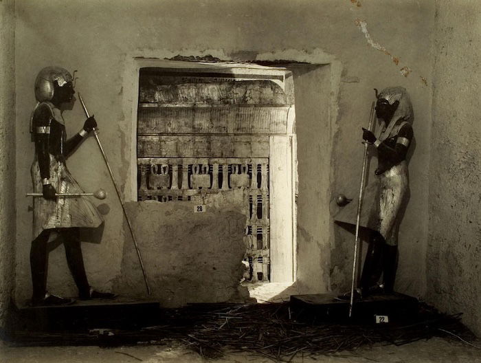 A pair of Tutankhamun’s black lacquer tomb guardians, Harry Burton, c.1923. Heidelberg University Library. Public Domain.