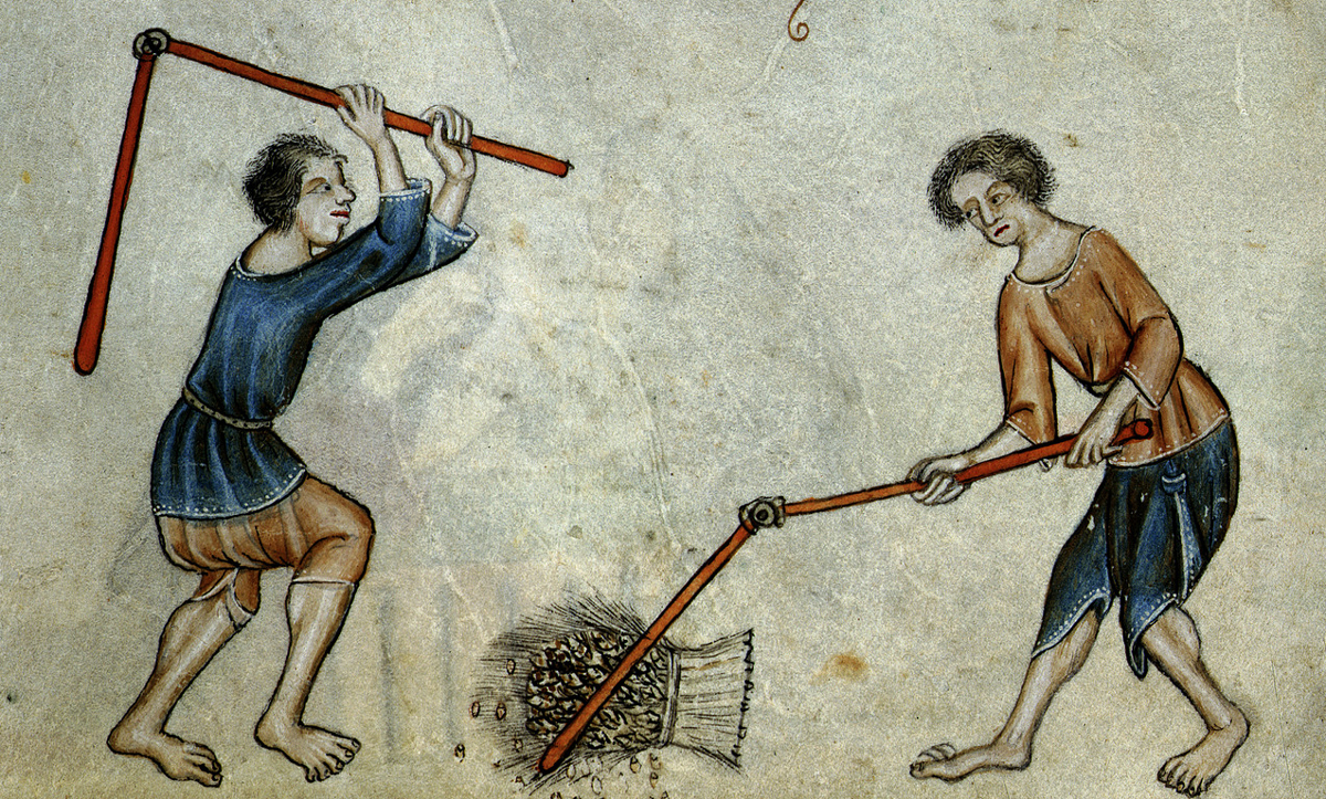 Two men threshing sheaf, c. 1325-1335, from the Luttrell Psalter, Add. 42130, f.74v. British Library/Wiki Commons.