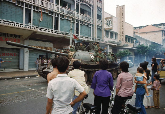 North Vietnamese troops arrive in Saigon while South Vietnamese civilians look on, 30 April 1975. Associated Press/Alamy Stock Photo.