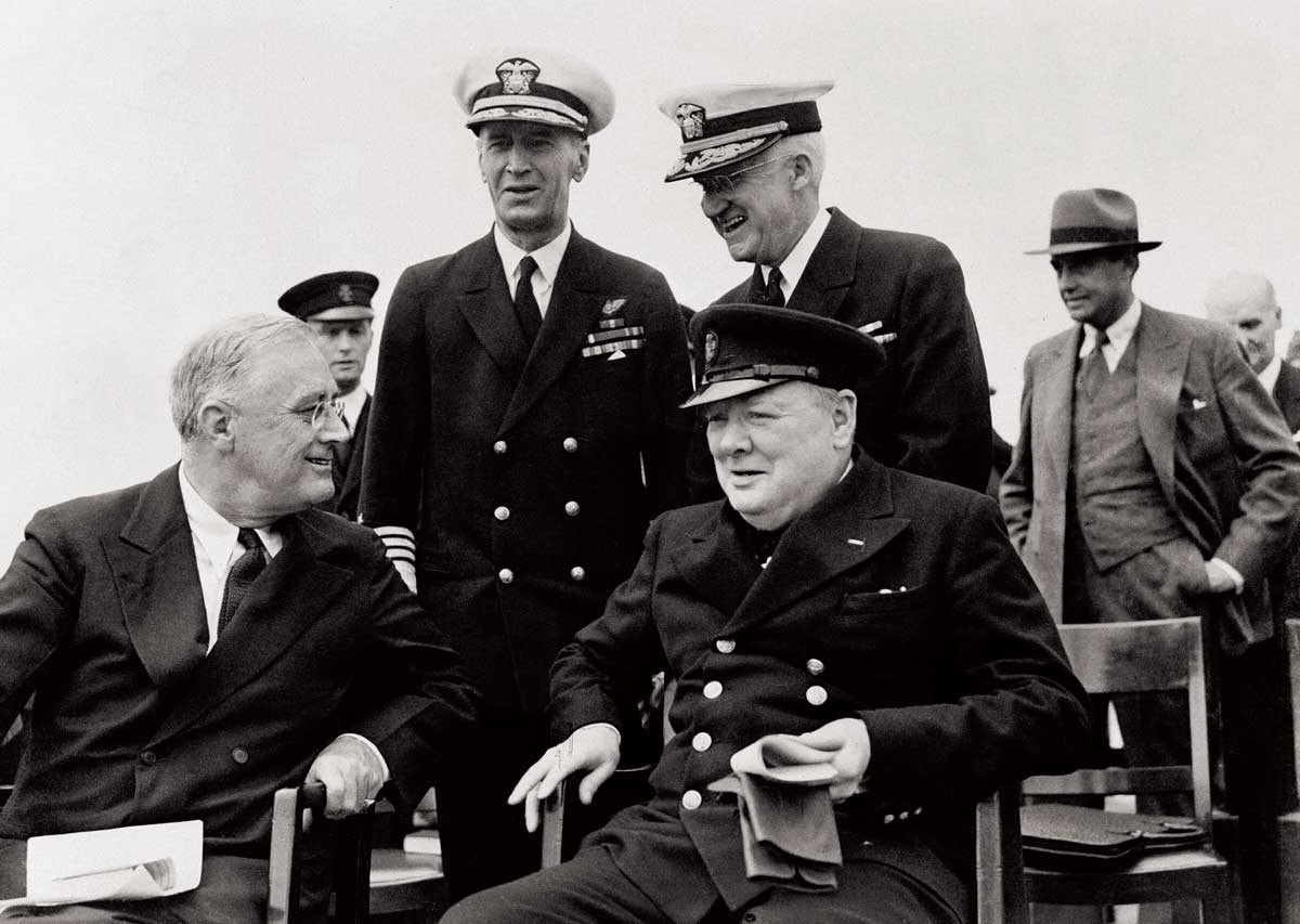 Roosevelt and Churchill seated on the quarter deck of HMS Prince of Wales, 10 August 1941. Imperial War Museum, London.