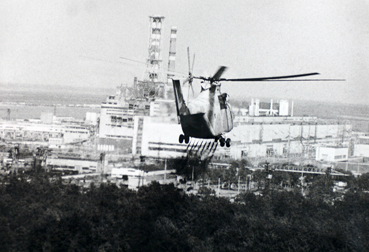 A helicopter sprays decontamination liquid near Chernobyl, 13 June 1986.